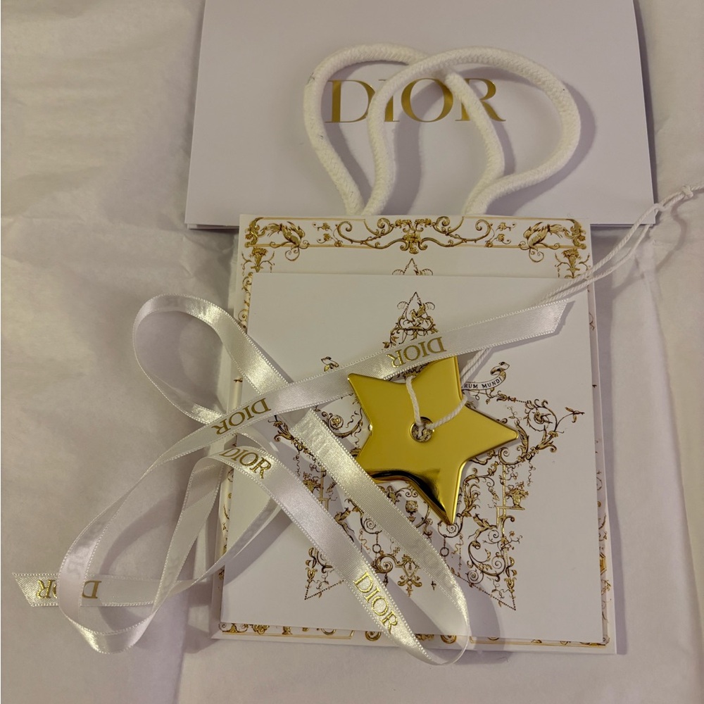 Dior bag, ribbon, card, and charm